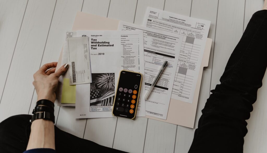 Accountant reviewing figures with a calculator