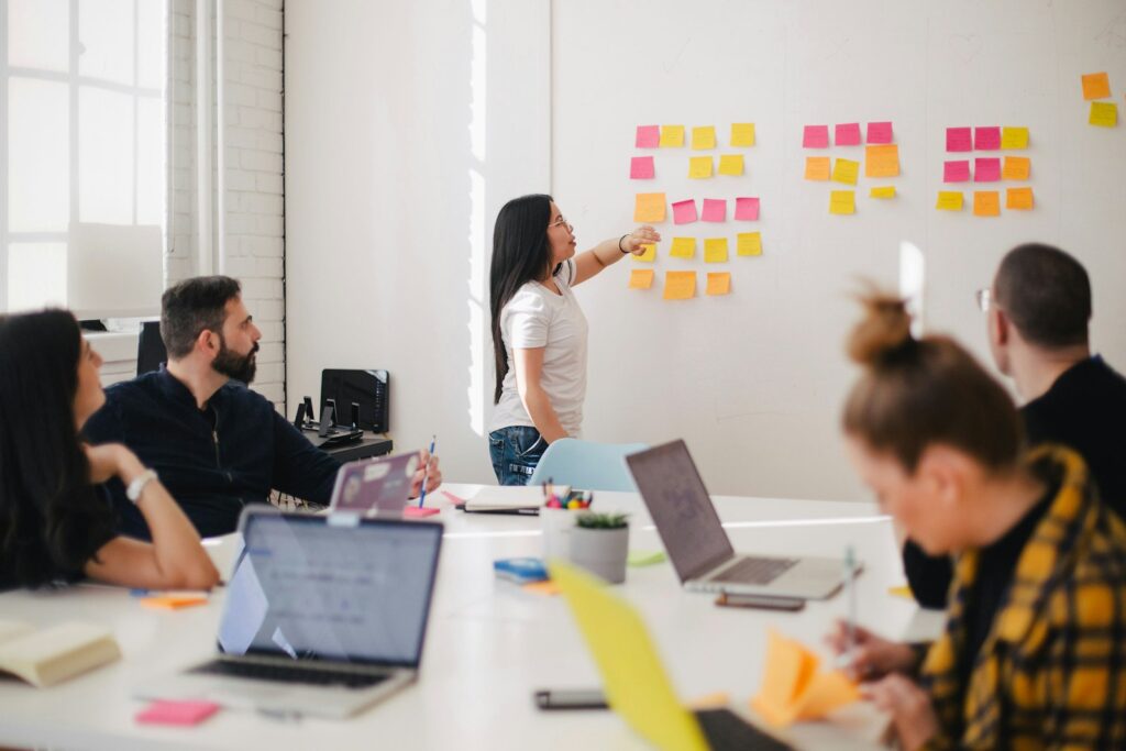 Creative team planning a campaign at a whiteboard